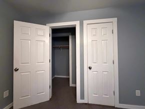 East Point apartment for rent - A room with two white doors, one open to a hallway.