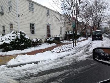 Washington apartment for rent - A car is parked on a snowy street.
