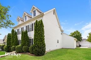 O'fallon house for rent - A white house with a green lawn in front.