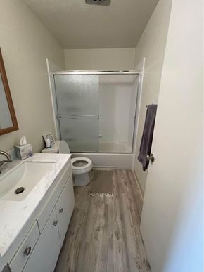 Hayward apartment for rent - A bathroom with a toilet, sink, and shower.