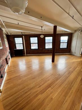 Brattleboro apartment for rent - A room with wooden floors and white walls.
