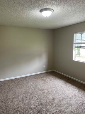 Lafayette apartment for rent - A room with a carpeted floor and a window letting in natural light.
