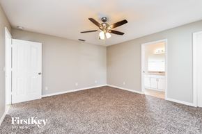 North Port house for rent - the master bedroom is spacious and clean with a ceiling fan