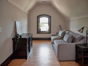 Cleveland Heights apartment for rent - A living room with a grey couch and a wooden floor.