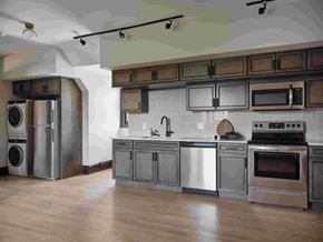 Cleveland Heights apartment for rent - A modern kitchen with stainless steel appliances and wooden cabinets.