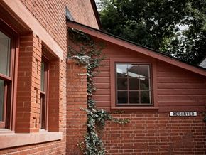 Cleveland Heights apartment for rent - A red brick building with a window and a sign that says "RESERVED".