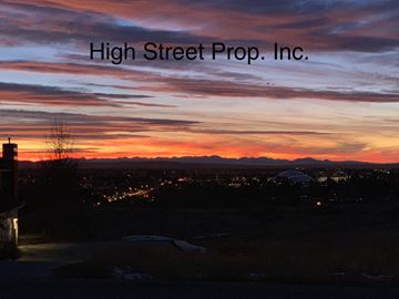 Bozeman apartment for rent - A sunset view with the text "High Street Prop. Inc." overlaid on the image.