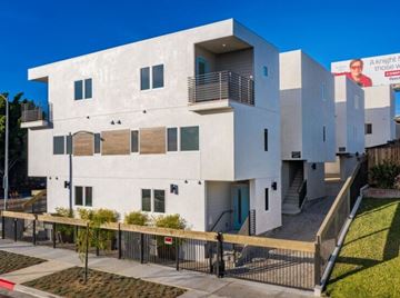 Los Angeles apartment for rent - a white building with a fence in front of it