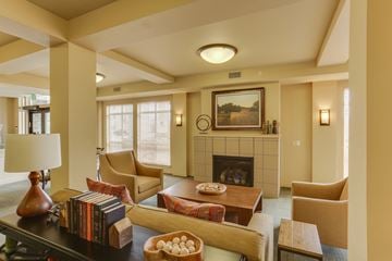 Billings apartment for rent - A living room with a fireplace and a painting on the wall.