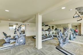 Billings apartment for rent - A gym with a variety of exercise equipment including treadmills, stationary bikes, and weight machines.