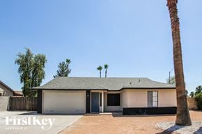 Glendale house for rent - A house with a palm tree in front of it.