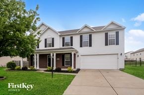 Indianapolis house for rent - a white house with black shutters and a driveway