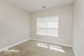 Mcdonough house for rent - the living room of a new home with white walls and a window