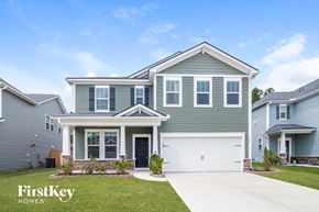 Summerville house for rent - a blue house with a white garage door