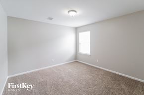 Summerville house for rent - a spacious room with carpet and a window