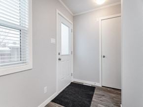 Saskatoon apartment for rent - the entrance to a bedroom with a door and a window