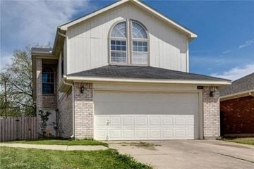 Arlington house for rent - A two-car garage is attached to a house.