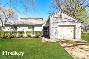 Collierville house for rent - A house with a garage and a driveway in front of it.