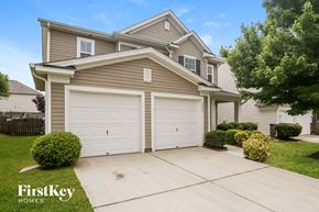 Charlotte house for rent - A two-car garage is attached to a house.