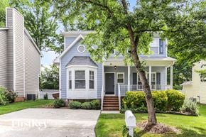 Greensboro house for rent - a blue house with a tree in front of it