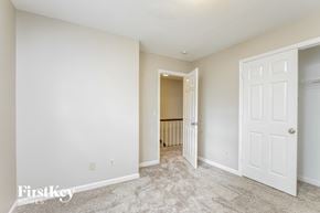 Greensboro house for rent - a bedroom with a closet and a door to a hallway