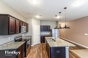 Bethlehem house for rent - a kitchen with granite counter tops and stainless steel appliances