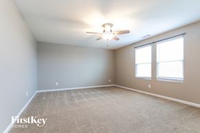 Bethlehem house for rent - the spacious living room with ceiling fan and two windows