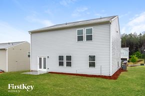 Bethlehem house for rent - the outside of a white house with a yard and grass