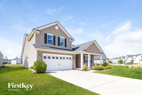 Summerville house for rent - a house with a driveway and a garage door