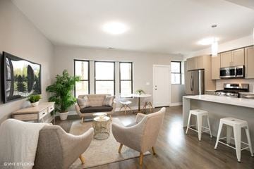 Chicago apartment for rent - an open kitchen and living room with chairs and a table