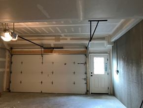 Peekskill apartment for rent - the living room of a garage with a door
