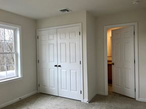 Peekskill apartment for rent - an empty bedroom with two closets and two doors