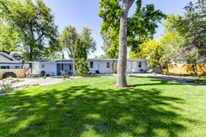 Lafayette apartment for rent - a white house with a yard and trees in front of it