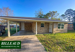 Carencro house for rent - a small brick house with a concrete driveway