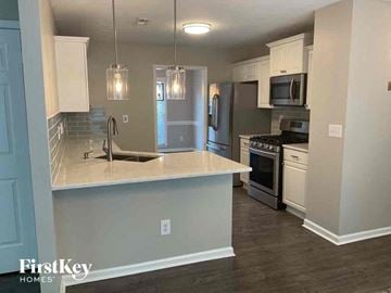 Dallas house for rent - a kitchen with a counter top and a sink