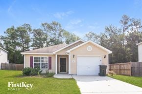 Goose Creek house for rent - A house with a garage and a driveway is for sale.