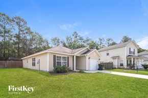 Goose Creek house for rent - A house with a fence and a garage is shown in the image.