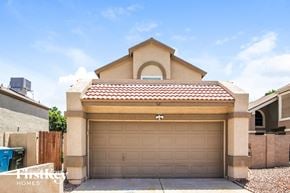Phoenix house for rent - a garage door in front of a house
