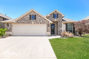 Burleson house for rent - a home with a white garage door and a lawn