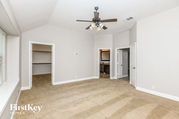 Burleson house for rent - a living room with carpet and a ceiling fan