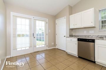Trenton house for rent - a kitchen with a dishwasher and a door to a patio