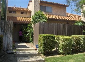Fontana apartment for rent - a house with a sidewalk and a fence