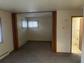 Fargo apartment for rent - A room with a window and a door.