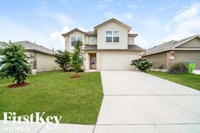 San Antonio house for rent - A house with a well-maintained lawn and a clear sky.