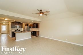 San Antonio house for rent - A spacious kitchen and living room with a ceiling fan.
