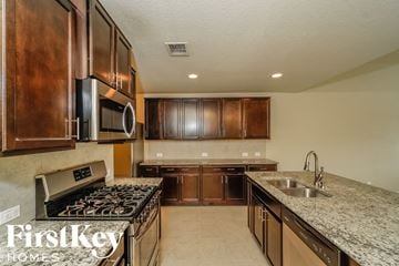 San Antonio house for rent - A kitchen with wooden cabinets and a granite countertop.