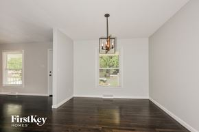 Saint Charles house for rent - an empty living room with white walls and a large window