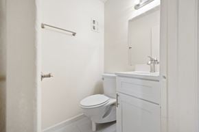 Lombard apartment for rent - a white bathroom with a toilet and a sink