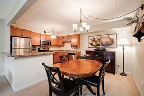 Lombard apartment for rent - a kitchen and dining room with a wooden table