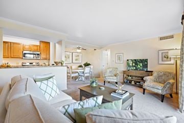 Lisle apartment for rent - A living room with a grey couch and a coffee table.